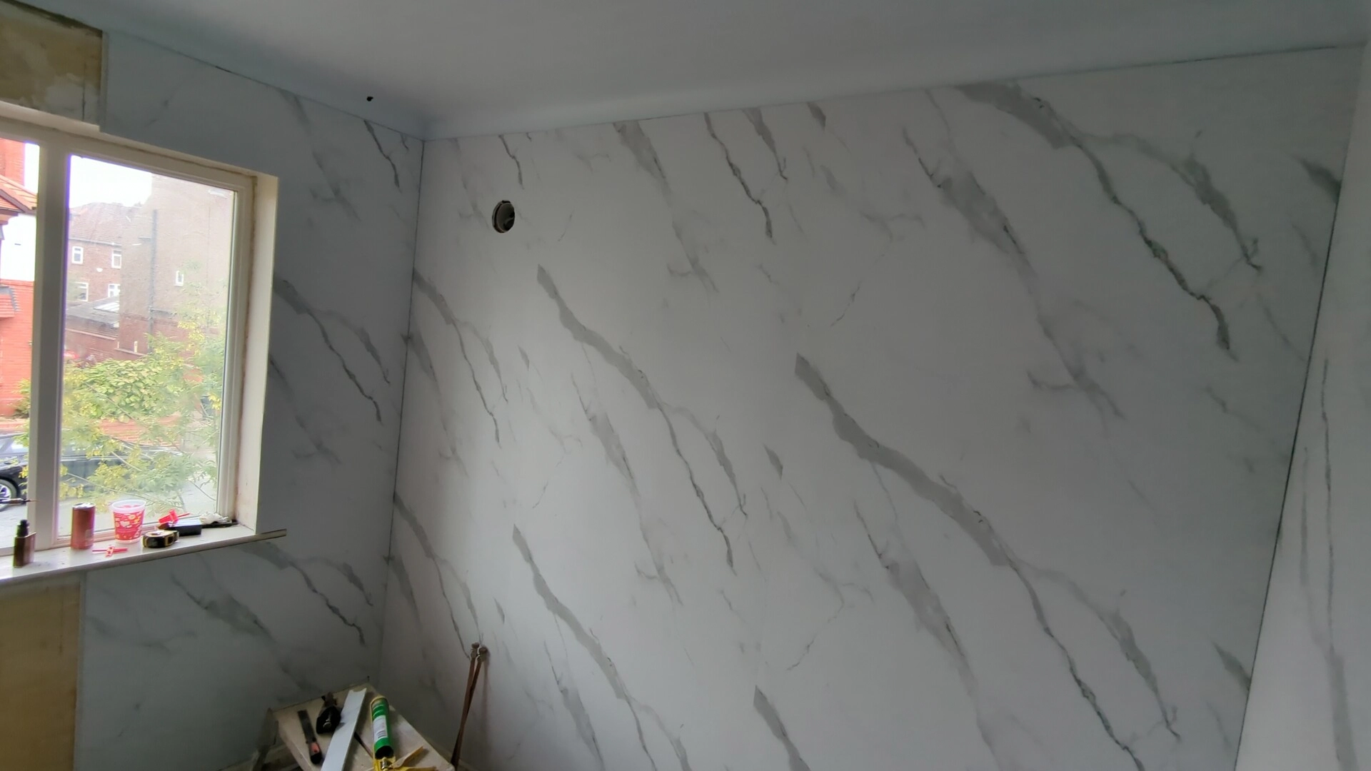 PVC bathroom wall panel with a cut-out for an extractor vent in a Doncaster ensuite