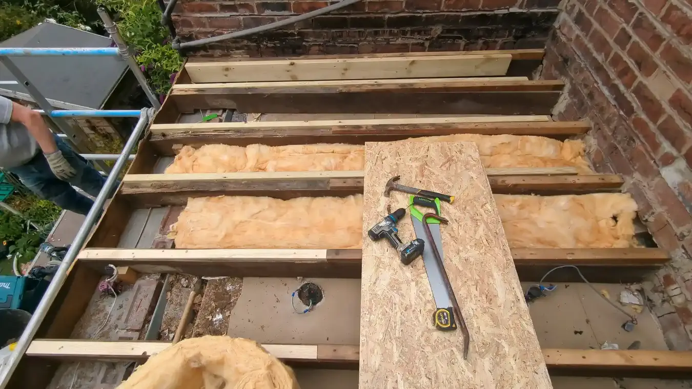 New full-length timbers fitted alongside the existing flat roof joists