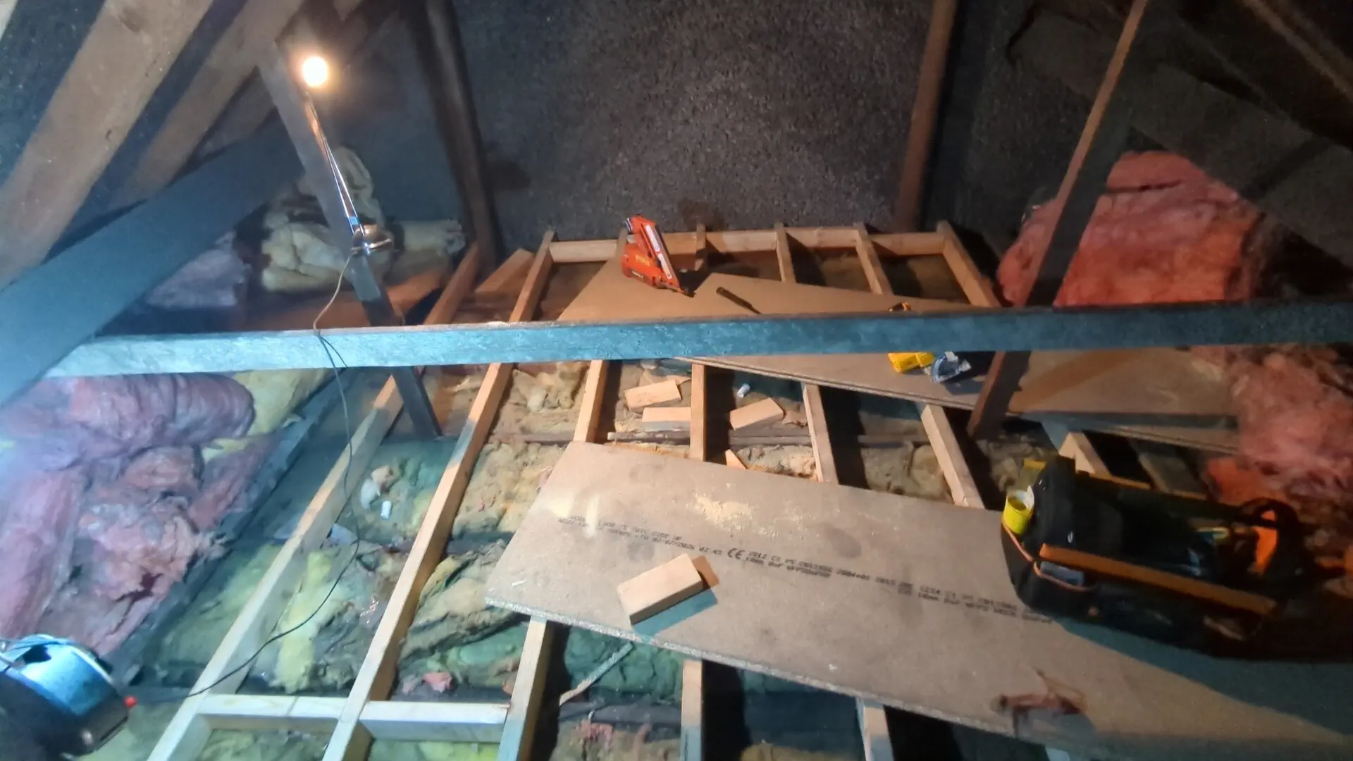New 4x2 C16 timber joists running across the existing ceiling joists to form a loft floor
