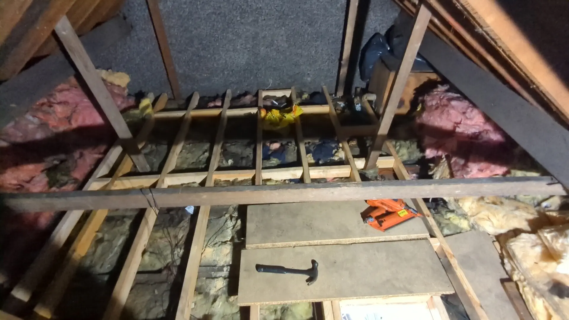 Timber noggins fitted between new loft floor joists to stiffen the deck