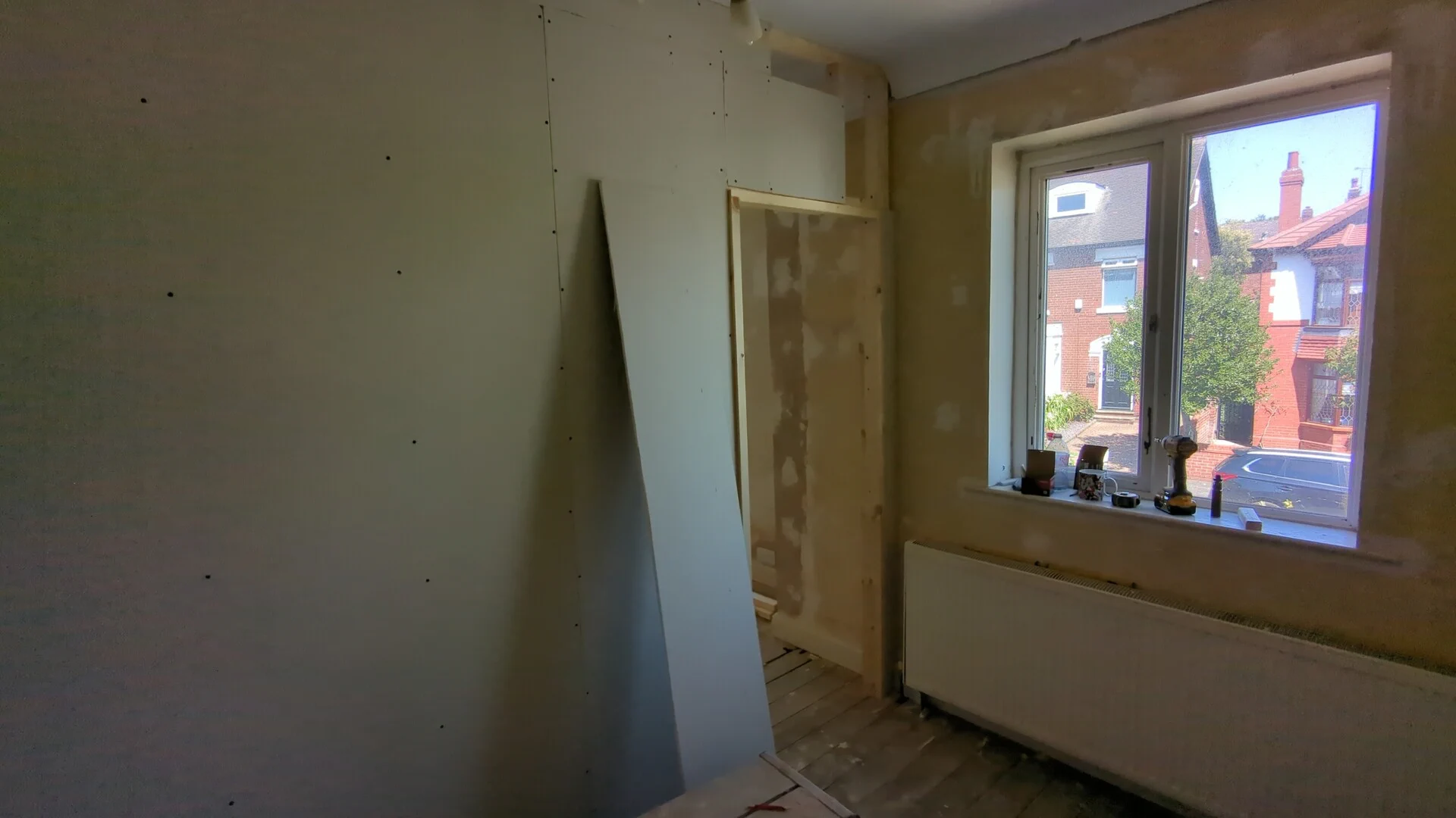 Door lining fitted in the plasterboarded stud partition wall