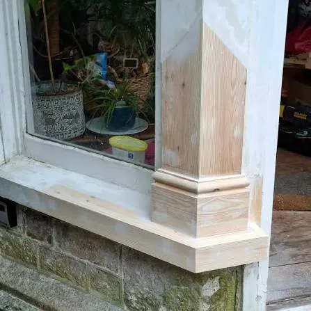 Timber splice repair let into an old wooden window frame