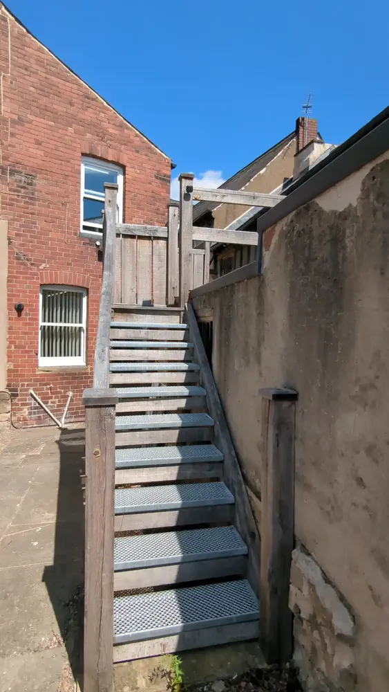 External solid oak staircase with non-slip metal treads at The Counting House
