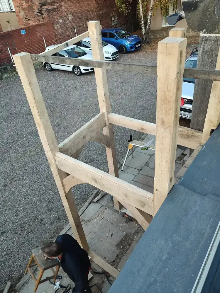 Assembled solid oak landing frame with newel posts and braces at The Counting House