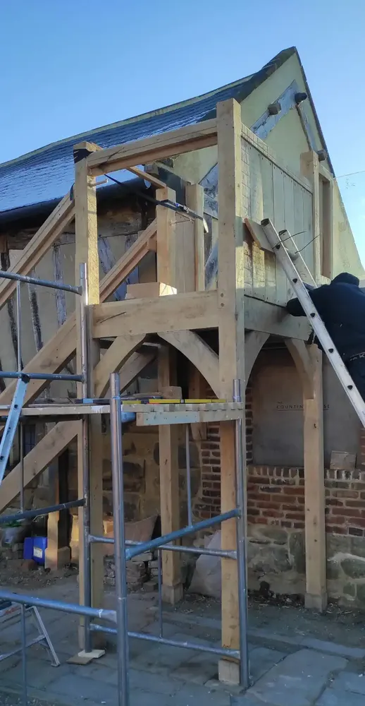 Oak landing frame under construction with scaffolding at The Counting House