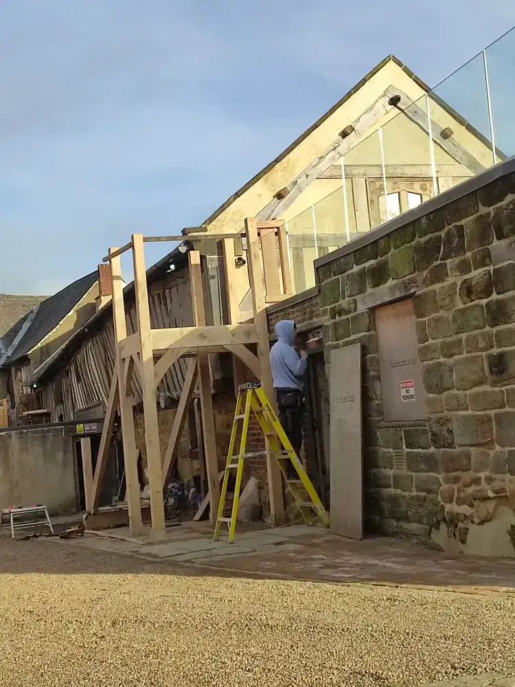 Oak newels and frame being set out to form the landing at The Counting House