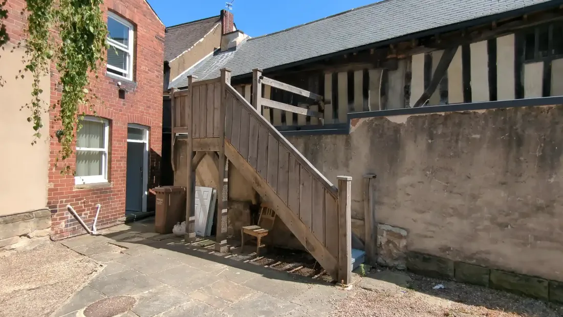 Rear external solid oak staircase rising to the first floor at The Counting House