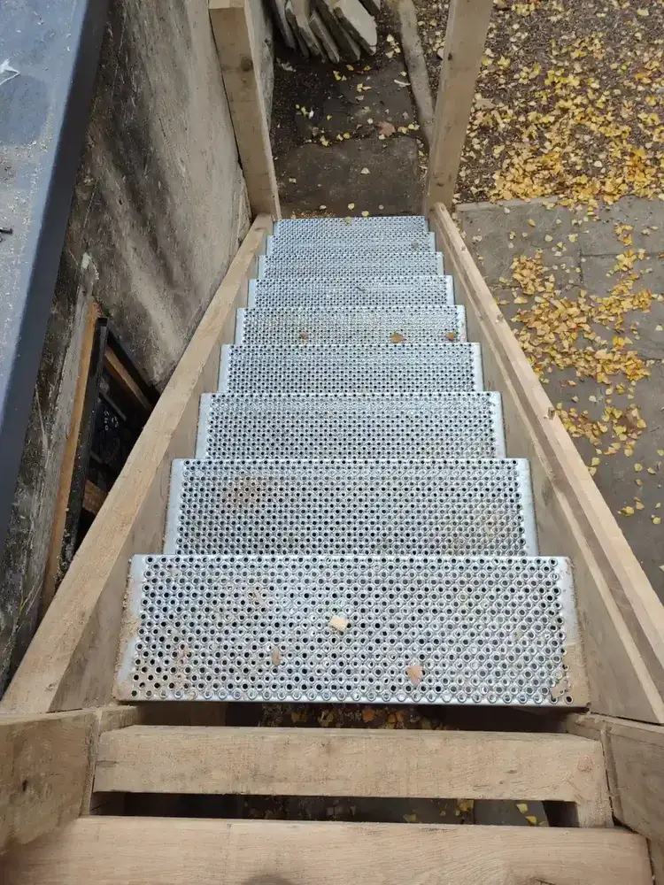 Non-slip metal treads fitted into the solid oak staircase flight at The Counting House