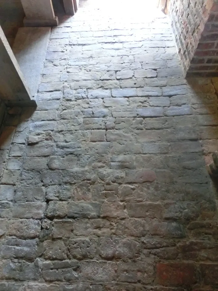Original stone-flagged floor and exposed brick with oak detailing at The Counting House