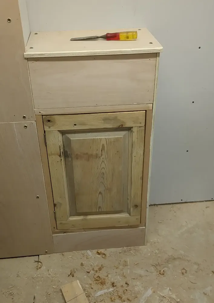 Original Victorian panelled cupboard door being restored and refitted at The Counting House