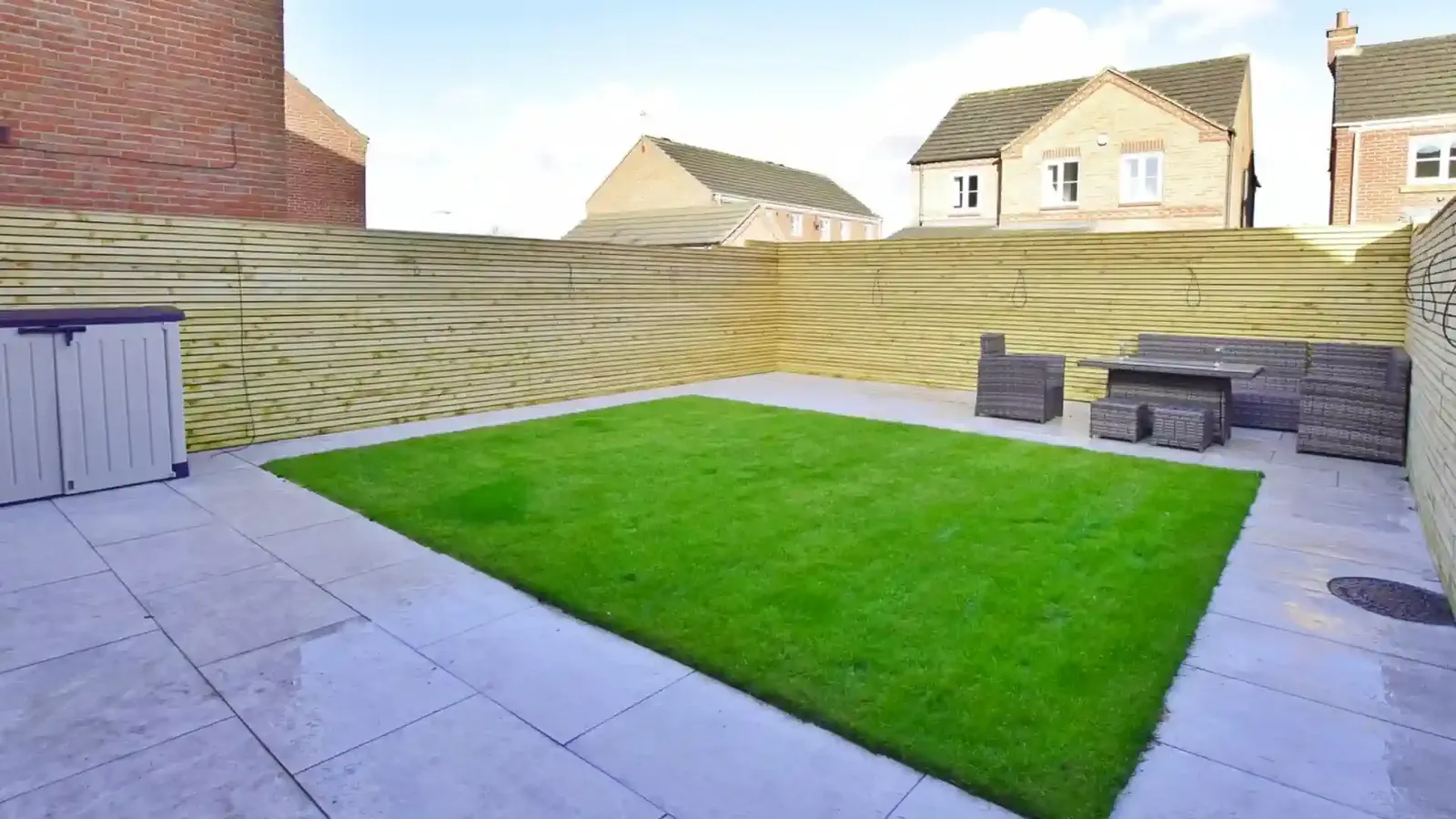 Timber fencing and screening enclosing a landscaped garden